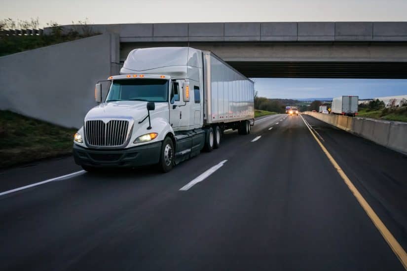 truck-driving-under-a-bridge