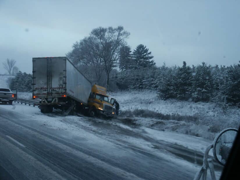 photo of crashed truck in winter