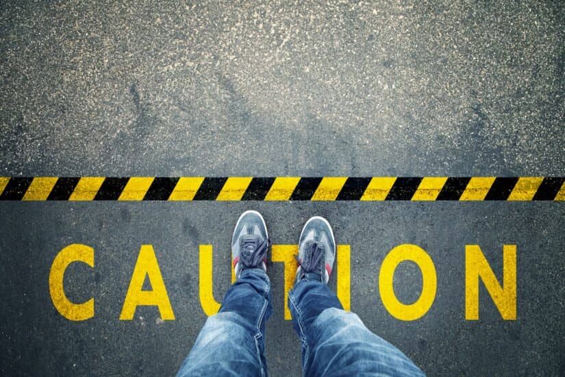 photo of person standing by caution line