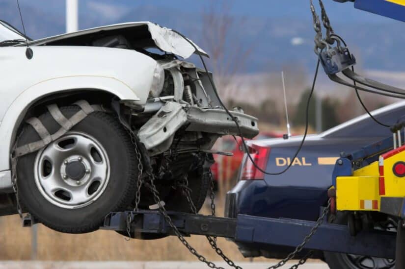 photo of car being removed from place of accident