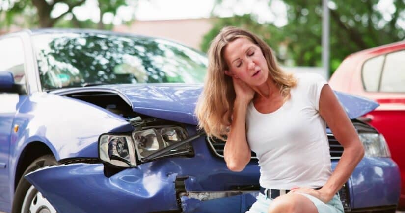 Woman Holding Her Head After A Car Accident